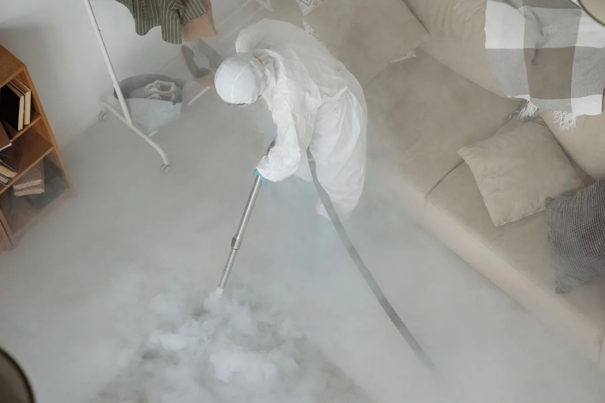 Biohazard cleanup technician in protective equipment, Alva, FL